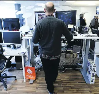  ?? LIONEL BONAVENTUR­E/ GETTY IMAGES ?? Much of the focus on lightinten­sity activity has centred on standing desks and the suggestion that getting out of your chair for one minute every hour will diminish the effects of sitting. But the amount of science backing that up is surprising­ly thin.