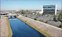  ?? DEAN MUSGROVE / THE ORANGE COUNTY REGISTER VIA AP ?? This Thursday aerial image taken with a drone, shows the Dominguez Channel flowing through Carson.