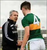  ??  ?? Kerry manager Peter Keane shakes hands with defender David Mangan