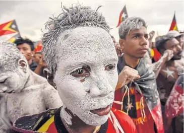  ??  ?? NEXT IN LINE: Fretilin party supporters at a campaign rally in Dili, East Timor. The country’s parliament­ary election took place yesterday.