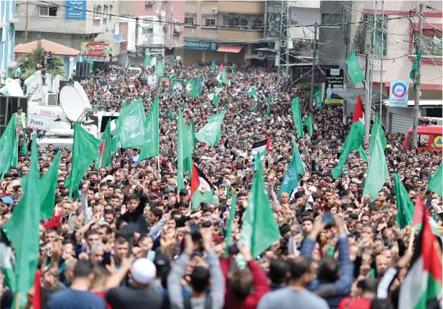  ?? (Mohammed Salem/Reuters) ?? HAMAS SUPPORTERS attend a protest to support Al-Aqsa mosque, in Gaza, last month.