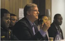  ?? Paul Kuroda / Special to The Chronicle ?? S.F. Police Chief Bill Scott (left) and Supervisor Jeff Sheehy (center) attend a meeting to address Dolores Park violence.