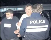  ?? GEORGIAN INTERIOR MINISTRY PRESS SERVICE VIA AP ?? Georgian police officers escort ex-President Mikheil Saakashvil­i after he was arrested in Rustavi, Georgia.