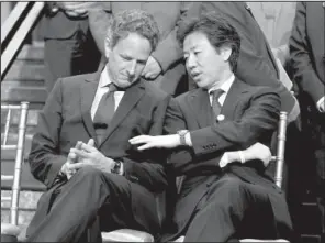  ?? AP ?? U.S. Treasury Secretary Timothy Geithner (left) speaks with Japanese Finance Minister Jun Azumi during an Internatio­nal Monetary Fund meeting Saturday in Washington.