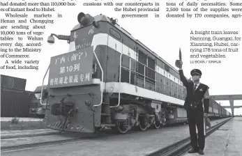  ?? LU BOAN / XINHUA ?? A freight train leaves Nanning, Guangxi, for Xianning, Hubei, carrying 178 tons of fruit and vegetables.