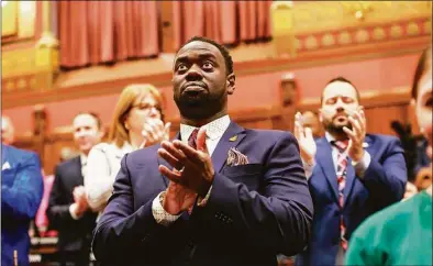  ?? Brian O’Connor / Associated Press ?? State Rep. Quentin Williams, D-Middletown, applauds during Connecticu­t Gov. Ned Lamont's State of the State address, Wednesday in Hartford. Williams was killed overnight in a wrong-way highway crash after having attended the governor's inaugural ball hours and after having been sworn in to a third term.