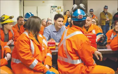  ?? CP PHOTO ?? Prime Minister Justin Trudeau speaks with workers during a visit to Stelco Hamilton Works in Hamilton Ont., Tuesday.