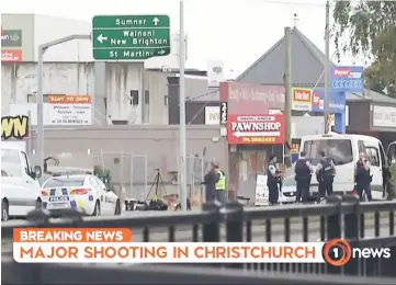  ?? — AFP photo ?? An image grab from TV New Zealand shows New Zealand police officers cordoning the area near the mosque.