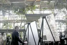  ?? Darrell Sapp/Post-Gazette ?? Dick Beuke, president at Vitro Architectu­ral Glass, shows new low-iron architectu­ral glass, left, that was installed on the ceiling of the Tropical Rainforest in the National Aviary. Next to it is a piece of acid-etched glass that was removed.