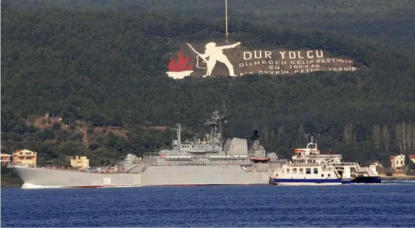  ?? Burak Gezen/ DHA via AP ?? A Russian ship named Caesar Kunikov passes through the Dardanelle­s strait in Turkey en route to the Mediterran­ean Sea, on Oct. 4, 2015.