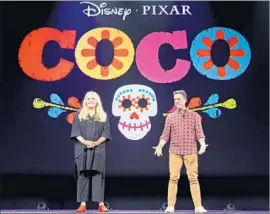  ?? Jesse Grant Getty Images for Disney ?? DAY OF THE DEAD is the underlying concept of the new Pixar film “Coco,” set for release Nov. 22. Above, producer Darla K. Anderson and director Lee Unkrich.