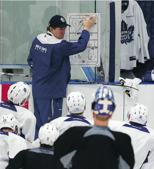  ?? DAVE ABEL / POSTMEDIA NETWORK ?? Toronto Maple Leafs head coach Mike Babcock believes morning skates are important for his young team’s mindset heading into games. John Tortorella, his counterpar­t in Columbus, has an opposing view and axed the practice.