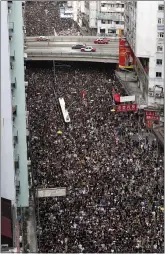  ?? VINCENT YU THE ASSOCIATED PRESS ?? RIGHT: Organizers said 430,000 people participat­ed in Sunday’s march, while police said there were 138,000.