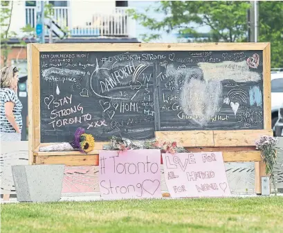  ?? RENÉ JOHNSTON/TORONTO STAR ?? A memorial was started at Logan Avenue Parkette. The Danforth is an unlikely place for this kind of horror, Vinay Menon writes.