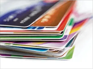  ?? DREAMSTIME ?? The American Bankers report found that only 29 percent of credit card accounts were paid in full each month while nearly half carry a balance. With the average credit card interest rate near 16.5 percent, revolving balances are a wildly expensive way...