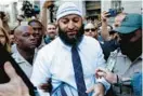  ?? BALTIMORE SUN FILE ?? Adnan Syed leaves the courthouse Sept. 19 after his murder conviction was overturned in Baltimore and he was freed after he spent 23 years in prison.