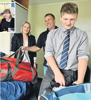  ?? PHOTOS: LINDA ROBERTSON ?? Making my space . . . Charlie Ottrey unpacks his gear and settles into life at the Otago Boys’ High School boarding hostel with the help of his parents Sarah and Hamish.