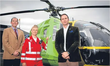  ??  ?? Douglas McAdam of SL&E, left, with SCAA chairman John Bullough and paramedic Julia Barnes.