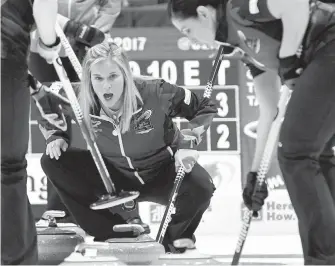  ?? CP ?? Team Jones skip Jennifer Jones calls to her sweepers during a draw against Team Sweeting at the Roar of the Rings Canadian Olympic Curling Trials in Ottawa on Saturday. Jones came back for a 9-6 win.