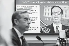  ?? Andrew Harrer / Bloomberg ?? A quote by Treasury Secretary Steven Mnuchin is displayed on a monitor during a House Financial Services Committee hearing with David Marcus, left, head of blockchain with Facebook Inc.