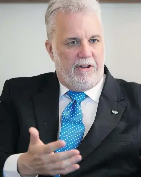  ?? PIERRE OBENDRAUF ?? Premier Philippe Couillard, concerned about linguistic intoleranc­e, is urging anglophone­s who have left Quebec to join the province’s surging economy.