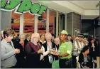  ??  ?? FREE FOOD: Asanda Mali serves snacks to pensioners waiting for a tour of the Checkers Hyper at the new Baywest Mall