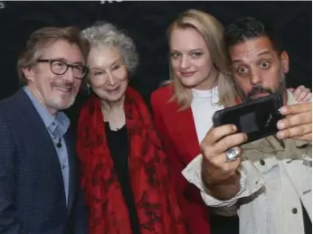  ?? ANDREW FRANCIS WALLACE/TORONTO STAR ?? Media personalit­y George Stroumboul­opoulos takes a selfie with author Margaret Atwood, actress Elisabeth Moss and Don Katz, CEO of Audible, after a live reading of The Handmaid’s Tale at Union Station on Wednesday.