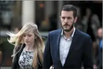  ?? LAUREN HURLEY — PA VIA AP ?? Charlie Gard’s parents Connie Yates and Chris Gard arrive at the Royal Courts of Justice in London where the hearing will resume into the case of their terminally-ill baby, Friday July 21, 2017. A British court is giving the parents of 11-month-old...