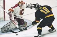  ?? CP PHOTO ?? Vancouver Canucks Pavel Bure scoring the winning goal against Mike Vernon in the second overtime period against the Calgary Flames on April 30, 1994.
