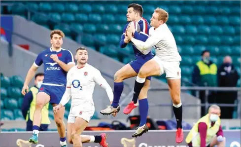  ?? AFP ?? France’s full-back Brice Dulin (second right) catches the ball against England’s full-back Max Malins (right) in a Six Nations match at Westham.