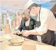  ?? ?? A chef at Dumplings’ Legend shows London Mayor Sadiq Khan how to make dumplings.