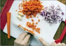  ?? SARAH E. CROWDER — KATIE WORKMAN VIA ASSOCIATED PRESS ?? This November 2016 photo provided by Katie Workman shows food being prepped for a meal in New York. One hour of meal prep on Sunday can make life easier and more delicious all week long.