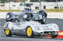  ??  ?? Lola MkI Prototype fends off Lister Jaguar Knobbly in Moss Trophy.