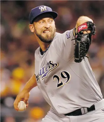  ?? Justin K. Aller/AFP/Getty Images ?? A year after being a minor league call-up sensation, Jim Henderson played a key reliever role for the Milwaukee Brewers.