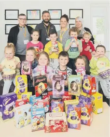  ??  ?? Children from Ashkirk Homelessne­ss Household Project are given a fantastic donation of Easter eggs from Gentoo.