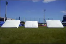  ?? BRYNN ANDERSON — THE ASSOCIATED PRESS ?? An old, smaller base sits between two new, larger bases at TD Ballpark in Dunedin, Fla., on Wednesday. The new bags at first, second and third are 18inches, three inches bigger than what was previously used across Major League Baseball.