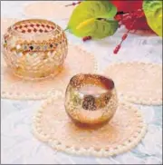  ??  ?? Lace doilies make for elegant bases and table mats
