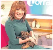  ??  ?? Lorraine on set with her new pup Angus.