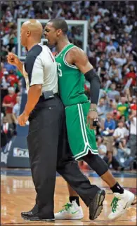  ??  ?? RAGING RONDO: Boston Celtics guard Rajon Rondo bumps referee Marc Davis late in the fourth quarter of Game One of a first- round NBA playoff series against the Atlanta Hawks on Sunday in Atlanta. Rondo was ejected, and the NBA suspended him for...