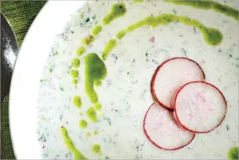  ?? Bob Chamberlin Los Angeles Times ?? BUTTERMILK SOUP with a drizzle of green oil and radish slices hits the spot when the mercury soars.