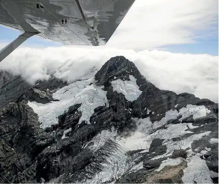  ?? PHOTOS: GEORGE HEARD/STUFF ?? Ice and snow clutching to the mountains in pockets as Niwa scientists have discovered while surveying the Southern Alps.
