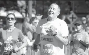  ?? Craig Ruttle/AP ?? Running: Robert Schenk, of Brick N.J., nears the finish line during the "Stephen Siller Tunnel to Towers" memorial event in New York on Sunday. The sponsors of the run honoring New York firefighte­r Stephen Siller, who died at the World Trade Center on...