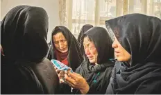  ?? Washington Post ?? After Hajar and her unborn baby’s burial, the women gathered inside one room to console her mother, mother-in-law and sister and pay their respect to the family.