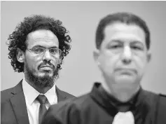  ??  ?? File photo hows alleged al-Qaeda-linked Islamist leader Ahmad Faqi Al Mahdi sitting in the courtroom of the Internatio­nal Criminal Court (ICC) in The Hague. — AFP photo