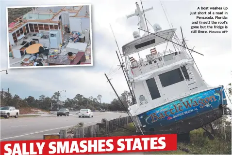  ?? Pictures: AFP ?? A boat washes up just short of a road in Pensacola, Florida; and (inset) the roof’s gone but the fridge is still there.