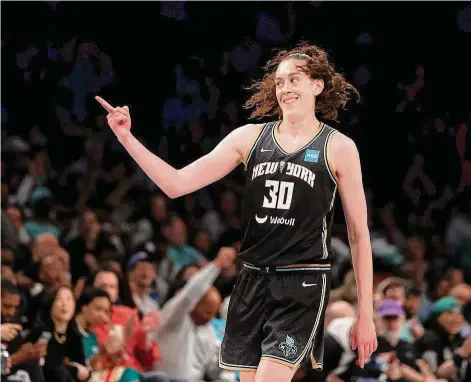  ?? Elsa/Getty Images ?? The Liberty’s Breanna Stewart celebrates after making a 3-pointer against the Fever at Barclays Center on Sunday in the Brooklyn. Stewart scored a franchise record 45 points in a 90-73 win.
