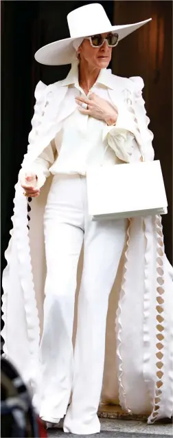  ??  ?? White lady: Celine Dion stepping out in Paris yesterday