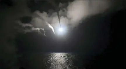  ?? MASS COMMUNICAT­ION SPECIALIST 3RD CLASS FORD WILLIAMS — U.S. NAVY VIA THE ASSOCIATED PRESS ?? In this image provided by the U.S. Navy, the guided-missile destroyer USS Porter (DDG 78) launches a Tomahawk land-attack missile in the Mediterran­ean Sea on Friday. The United States blasted a Syrian air base with a barrage of cruise missiles in fiery...