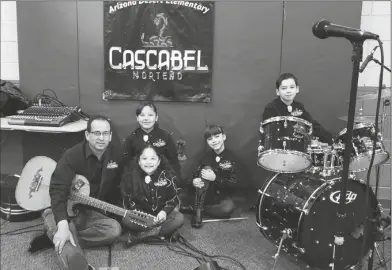  ?? LOANED PHOTO ?? MUSIC TEACHER DAVID CASTRO with members of Cascabel Norteño, a student norteño music group he helped formed.