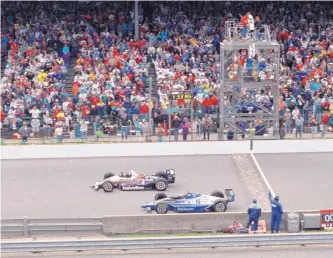  ?? DAVID BOE/ASSOCIATED PRESS FILE ?? Al Unser Jr., top, is shown winning the 1992 Indy 500 by less than a car length over Scott Goodyear in the 76th running of the race. Former champions of the race voted this one the best in Indy 500 history.